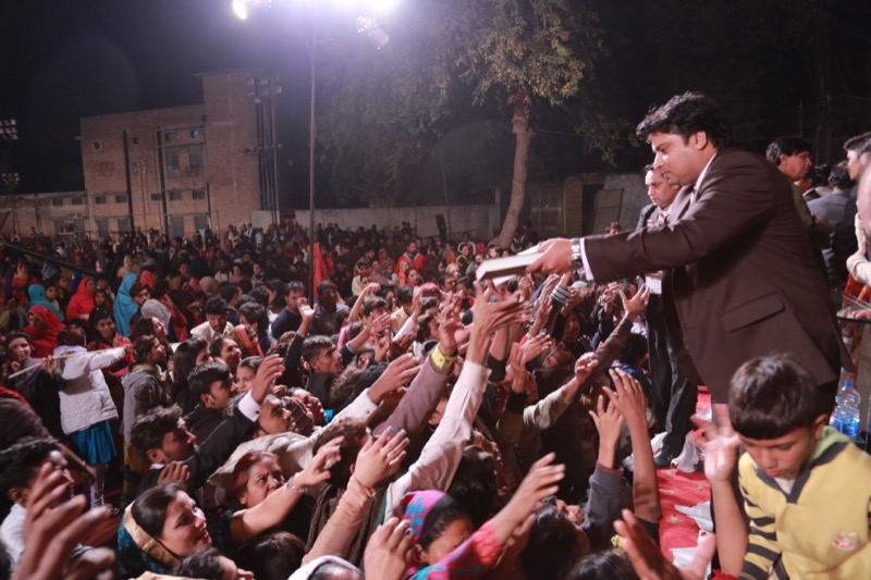 Free Urdu Bibles Distribution at Night Crusade in Pakistan