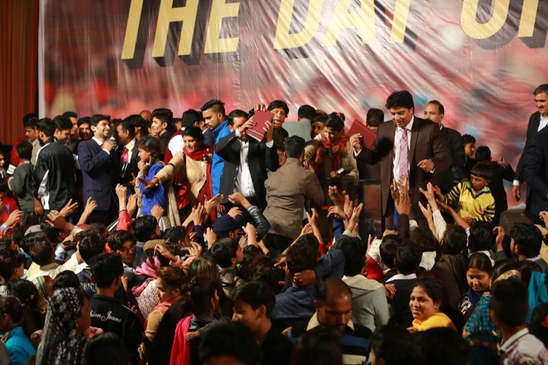 Free Urdu Bibles Distribution at Indoor Crusade Event